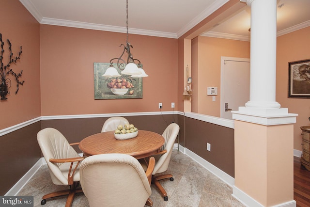 dining room featuring ornate columns and ornamental molding