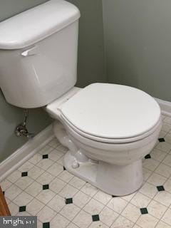 bathroom with tile patterned flooring and toilet