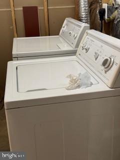 laundry area with washing machine and dryer