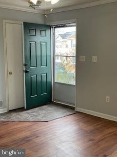 interior space with crown molding and wood-type flooring