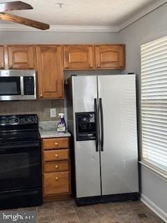 kitchen with crown molding, ceiling fan, and appliances with stainless steel finishes