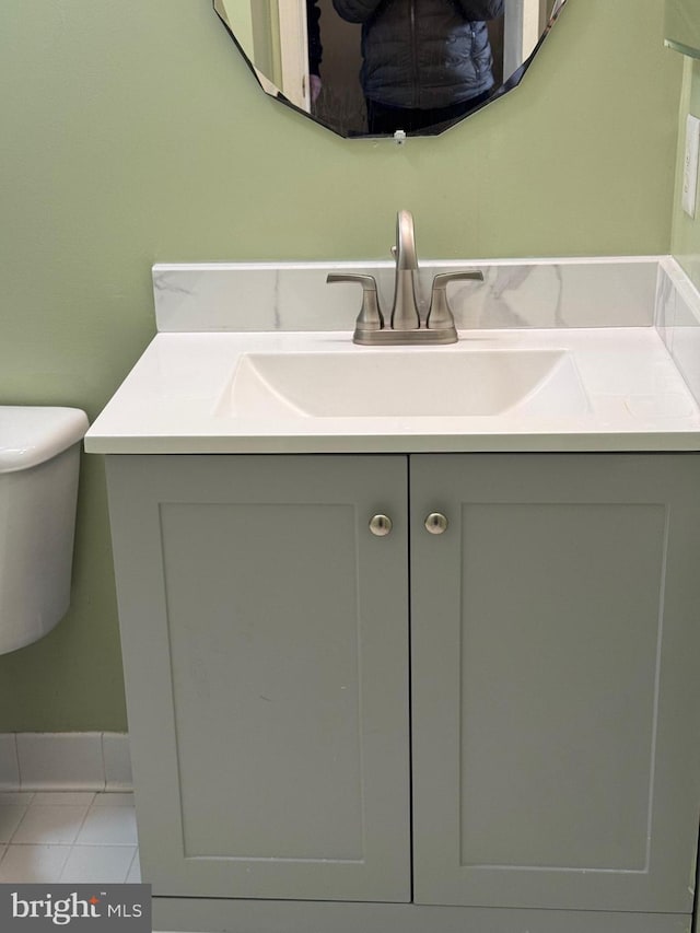 bathroom featuring vanity, toilet, and tile patterned flooring