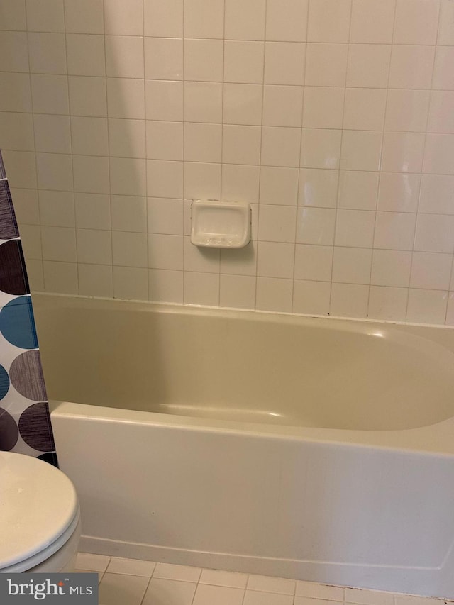 bathroom with tile patterned flooring and toilet