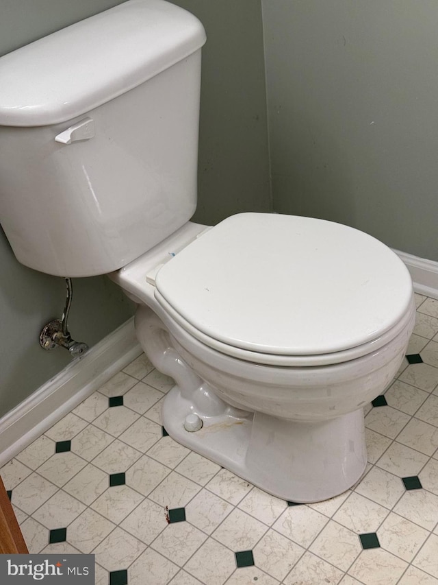 bathroom featuring tile patterned flooring and toilet