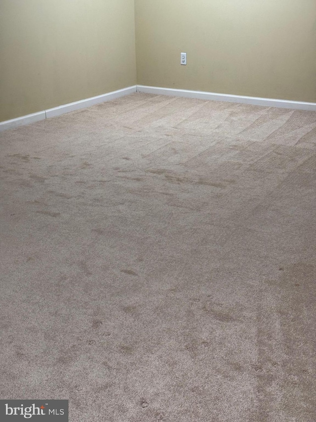 unfurnished room with carpet flooring