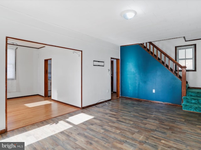 unfurnished living room featuring wood-type flooring