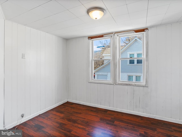 unfurnished room with dark hardwood / wood-style floors