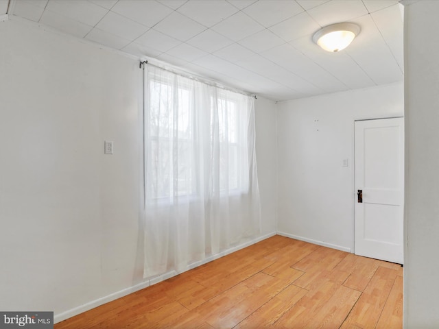 unfurnished room with light hardwood / wood-style flooring