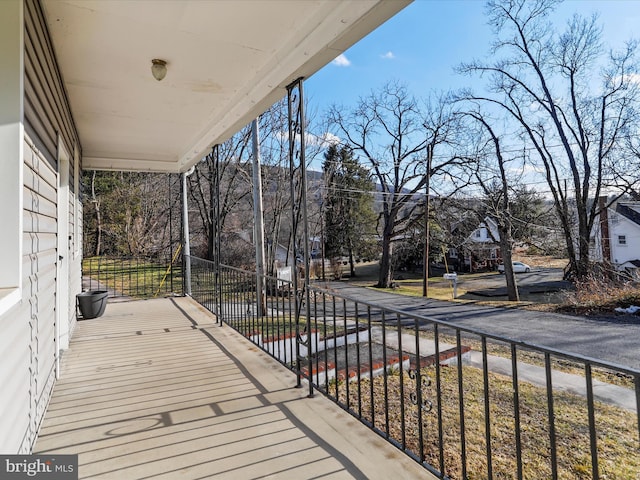 wooden terrace with a porch