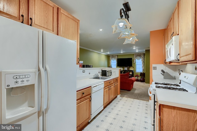 kitchen with sink, crown molding, pendant lighting, white appliances, and decorative backsplash