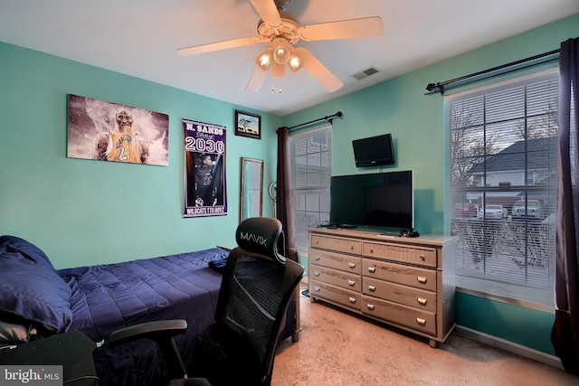 bedroom with light colored carpet and ceiling fan