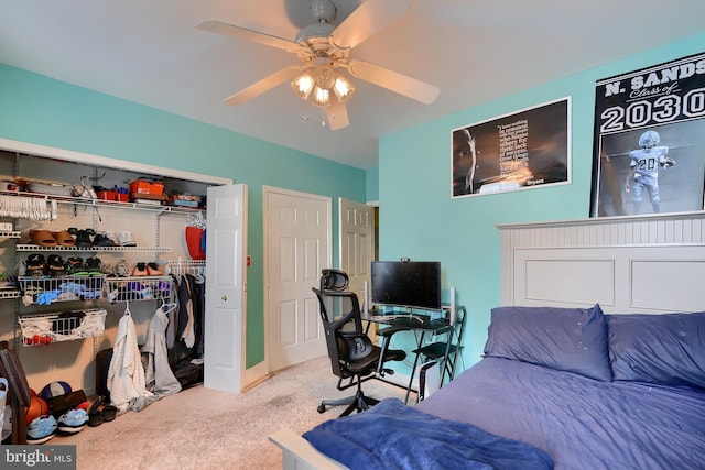 bedroom with ceiling fan, a closet, and light carpet