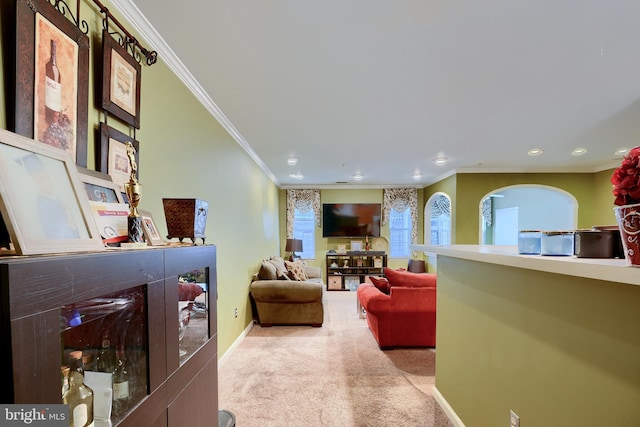 carpeted living room with crown molding