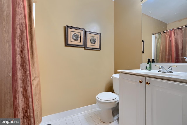 bathroom with tile patterned floors, toilet, and vanity