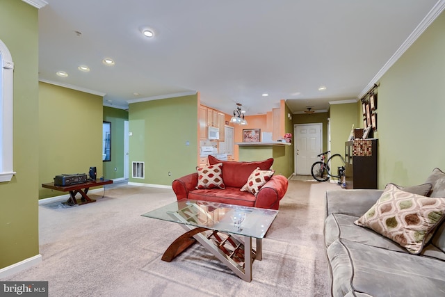 carpeted living room with ornamental molding