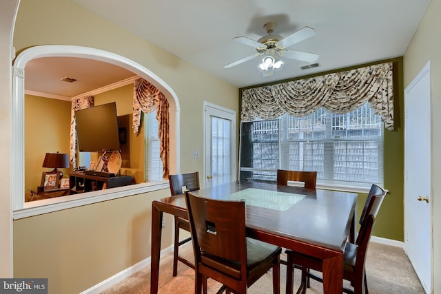 carpeted dining space featuring ceiling fan