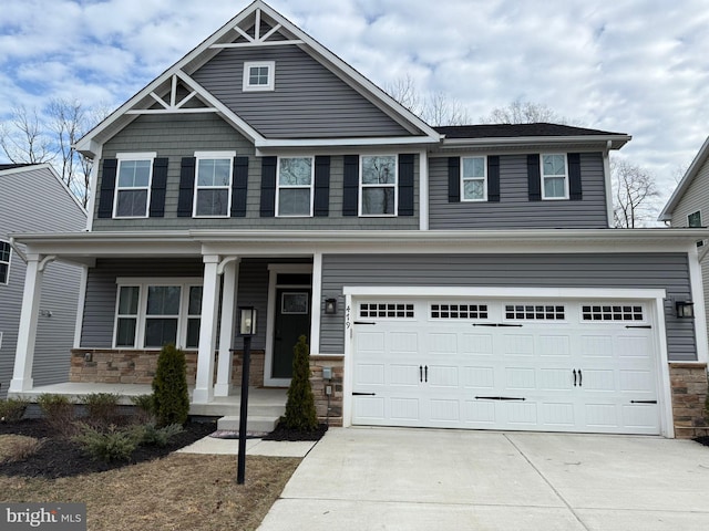 craftsman inspired home with a porch and a garage