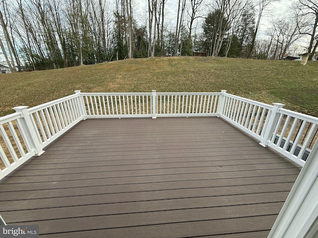 wooden terrace with a lawn