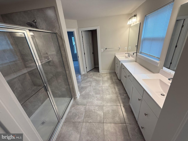 bathroom featuring vanity, tile patterned floors, and a shower with door