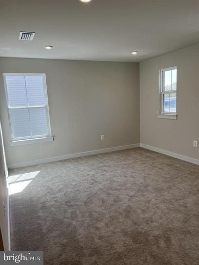 spare room featuring carpet floors