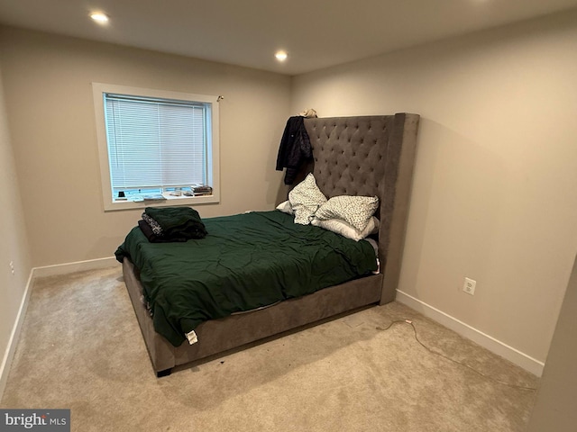 bedroom with light carpet