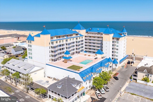 aerial view with a water view and a view of the beach