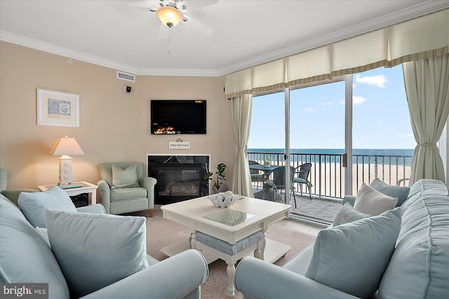 living room featuring ceiling fan and ornamental molding