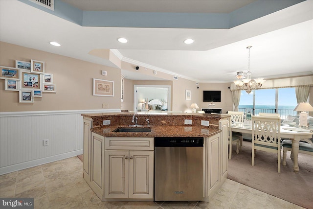 kitchen with sink, dark stone counters, hanging light fixtures, a kitchen island with sink, and stainless steel dishwasher