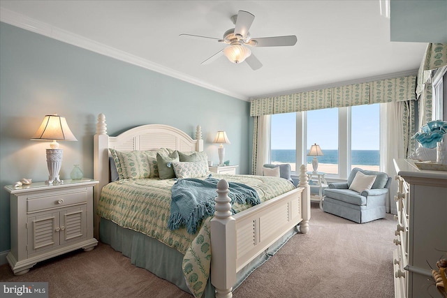 carpeted bedroom with crown molding, a water view, and ceiling fan