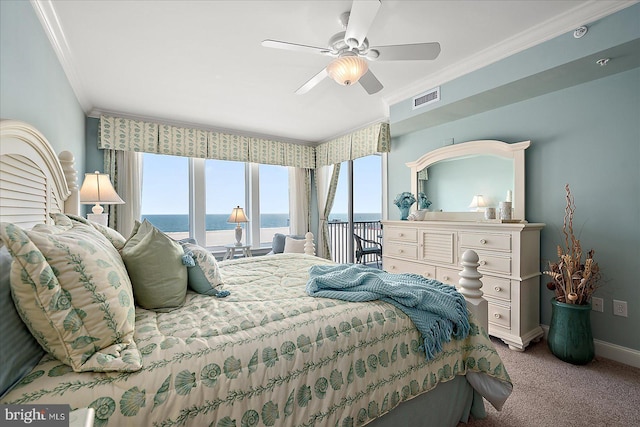 bedroom featuring crown molding, a water view, carpet floors, and ceiling fan