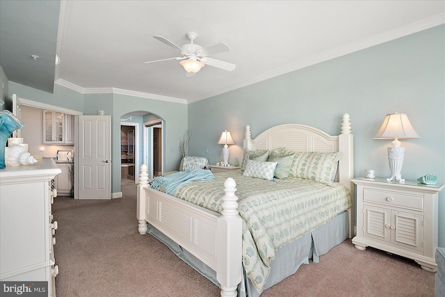 bedroom featuring crown molding, light colored carpet, and ceiling fan