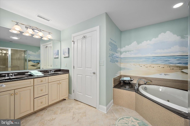 bathroom with vanity and separate shower and tub