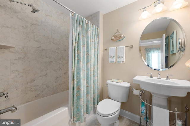 bathroom featuring toilet and shower / bath combo with shower curtain