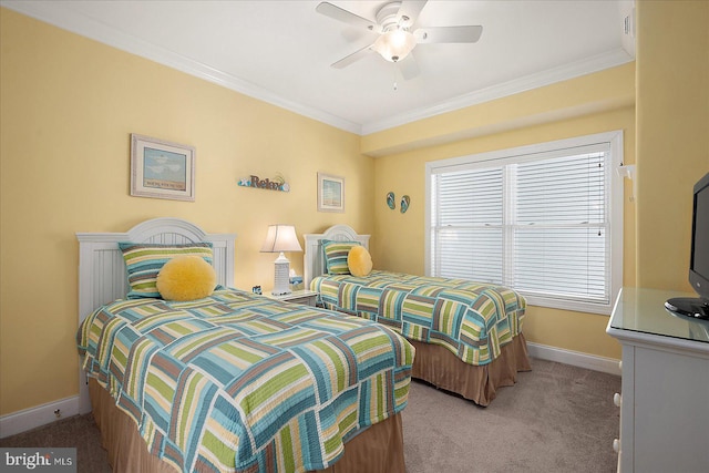 carpeted bedroom featuring crown molding and ceiling fan