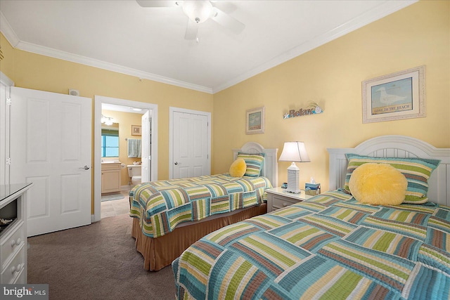 carpeted bedroom with ornamental molding, connected bathroom, and ceiling fan