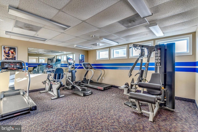 exercise room featuring a drop ceiling