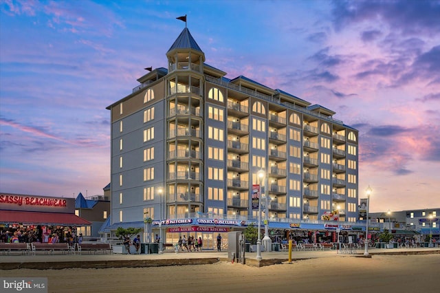 view of outdoor building at dusk