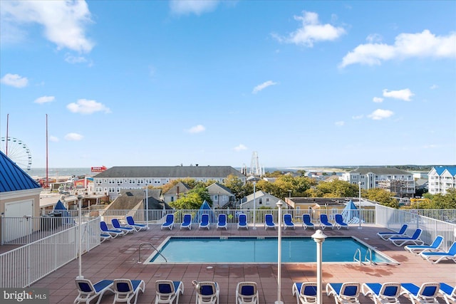 view of swimming pool featuring a patio