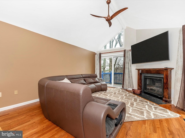 living room with beamed ceiling, ceiling fan, high vaulted ceiling, and light hardwood / wood-style floors