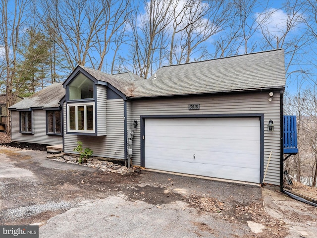 view of side of home featuring a garage