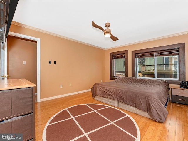 bedroom with crown molding and light wood-type flooring