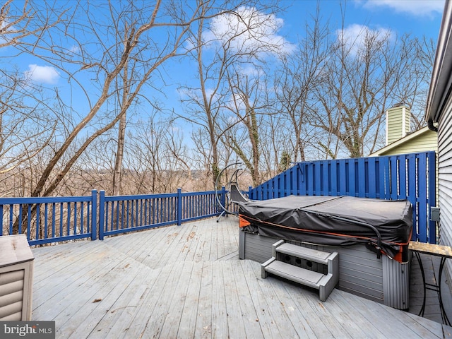 deck featuring a hot tub