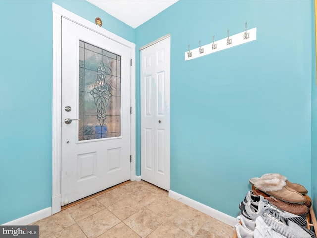 entryway featuring light tile patterned floors