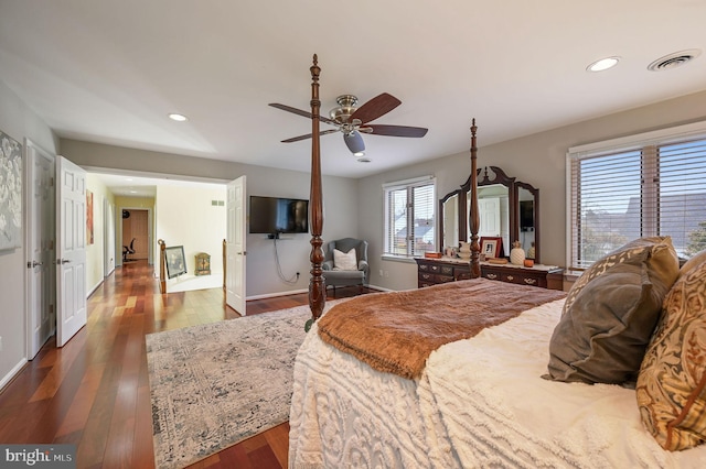 bedroom with ceiling fan and hardwood / wood-style floors