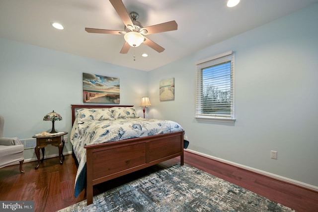 bedroom with ceiling fan and dark hardwood / wood-style floors