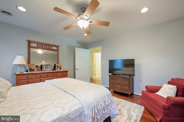 bedroom with dark wood-type flooring and ceiling fan