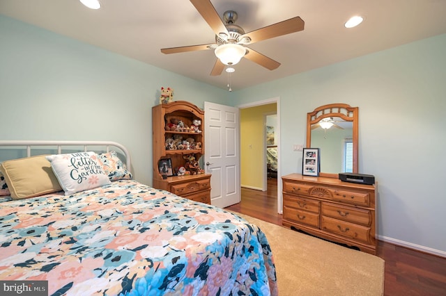 bedroom featuring dark hardwood / wood-style floors and ceiling fan