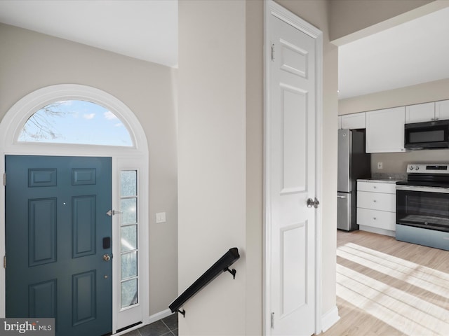 foyer entrance with light wood-type flooring