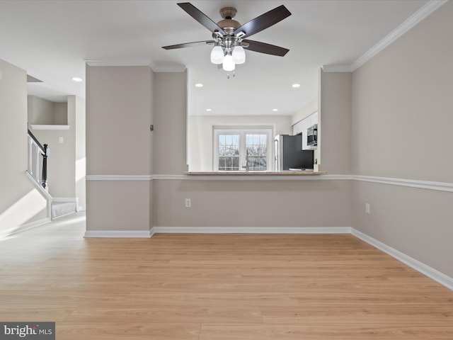 unfurnished living room with ornamental molding, ceiling fan, and light hardwood / wood-style floors