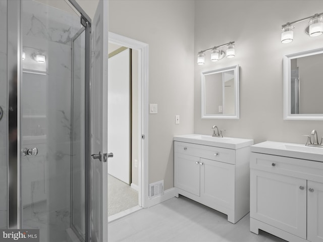 bathroom featuring walk in shower and vanity